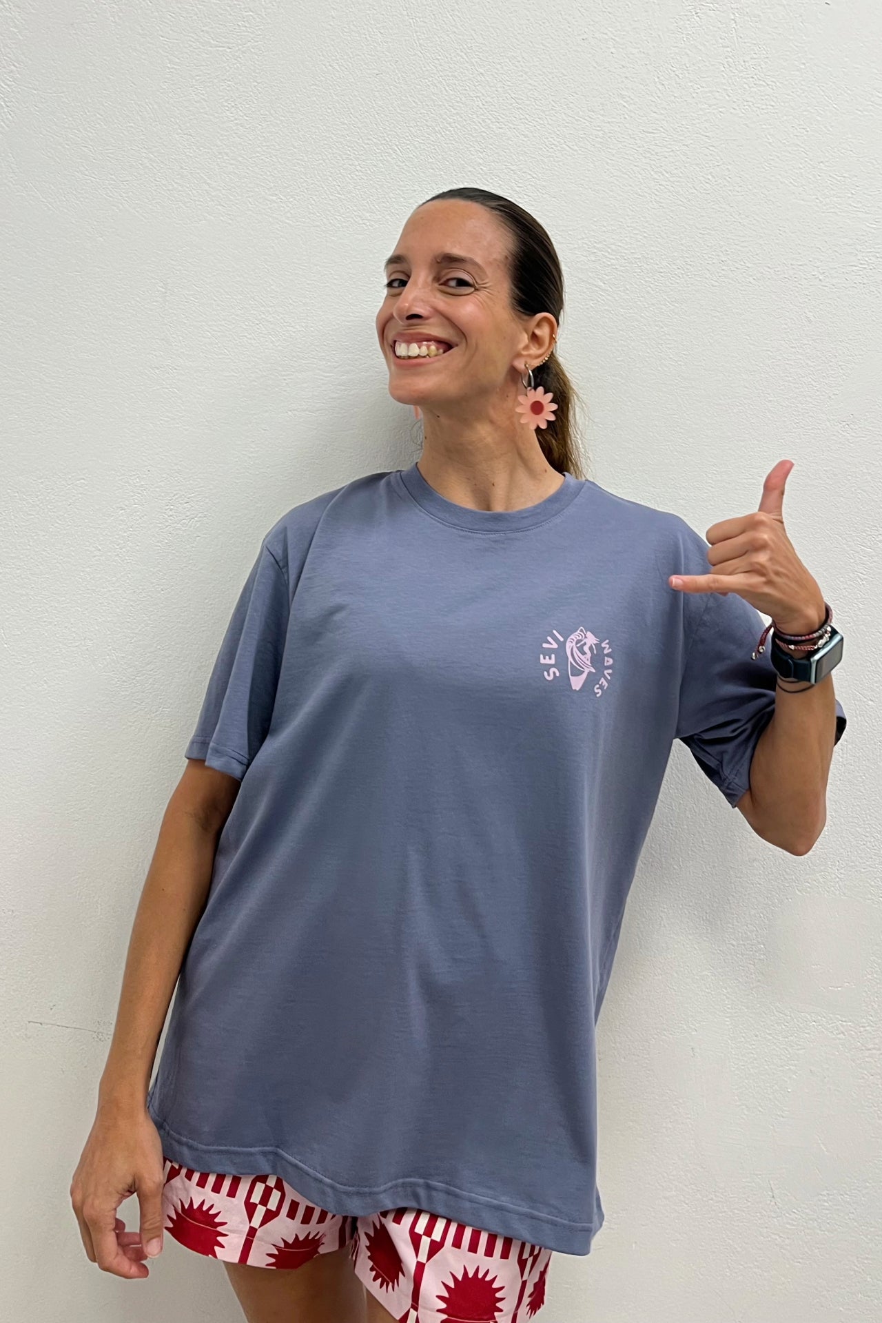Featuring an oversized unisex fit and an original sun-and-wave graphic