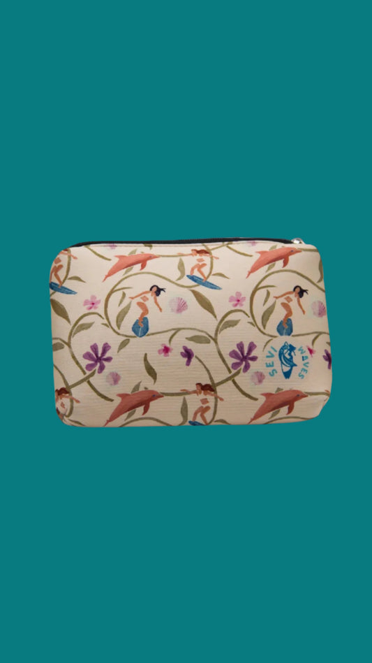 Cosmetic bag with dolphin and floral pattern on a white background