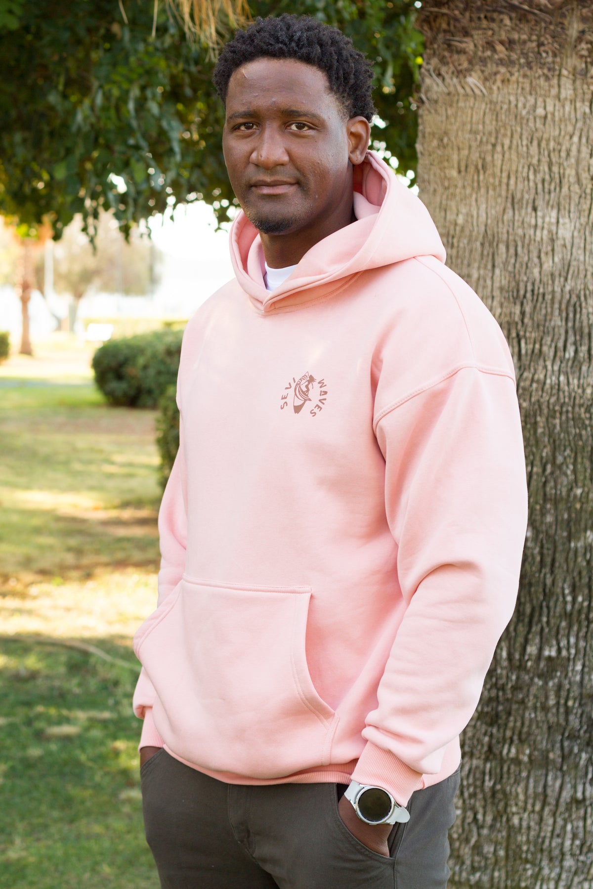 Sevi Waves TIDE SHIFT salmon oversized hoodie  featuring a palm trees and shells graphic on the back.