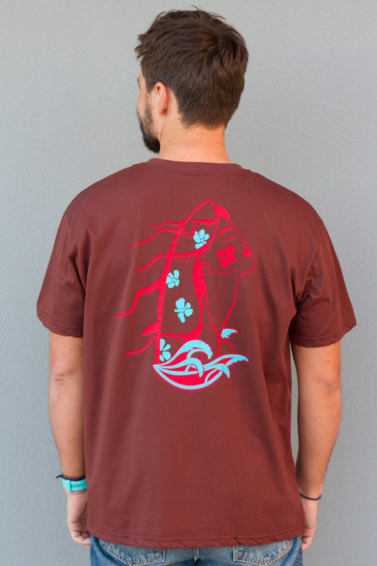 Man wearing a brown t-shirt with a graphic design on the back against a gray background