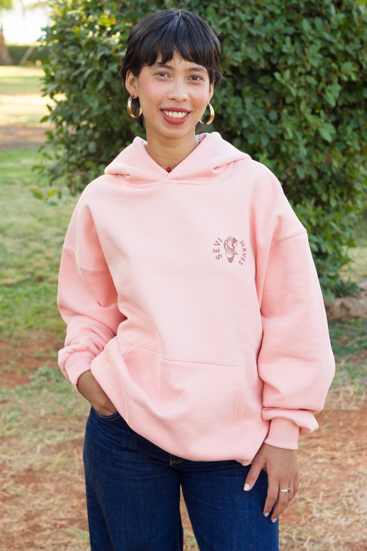 TIDE SHIFT FW26/27 salmon sweatshirt with a coastal-inspired graphic by Sevi Waves.