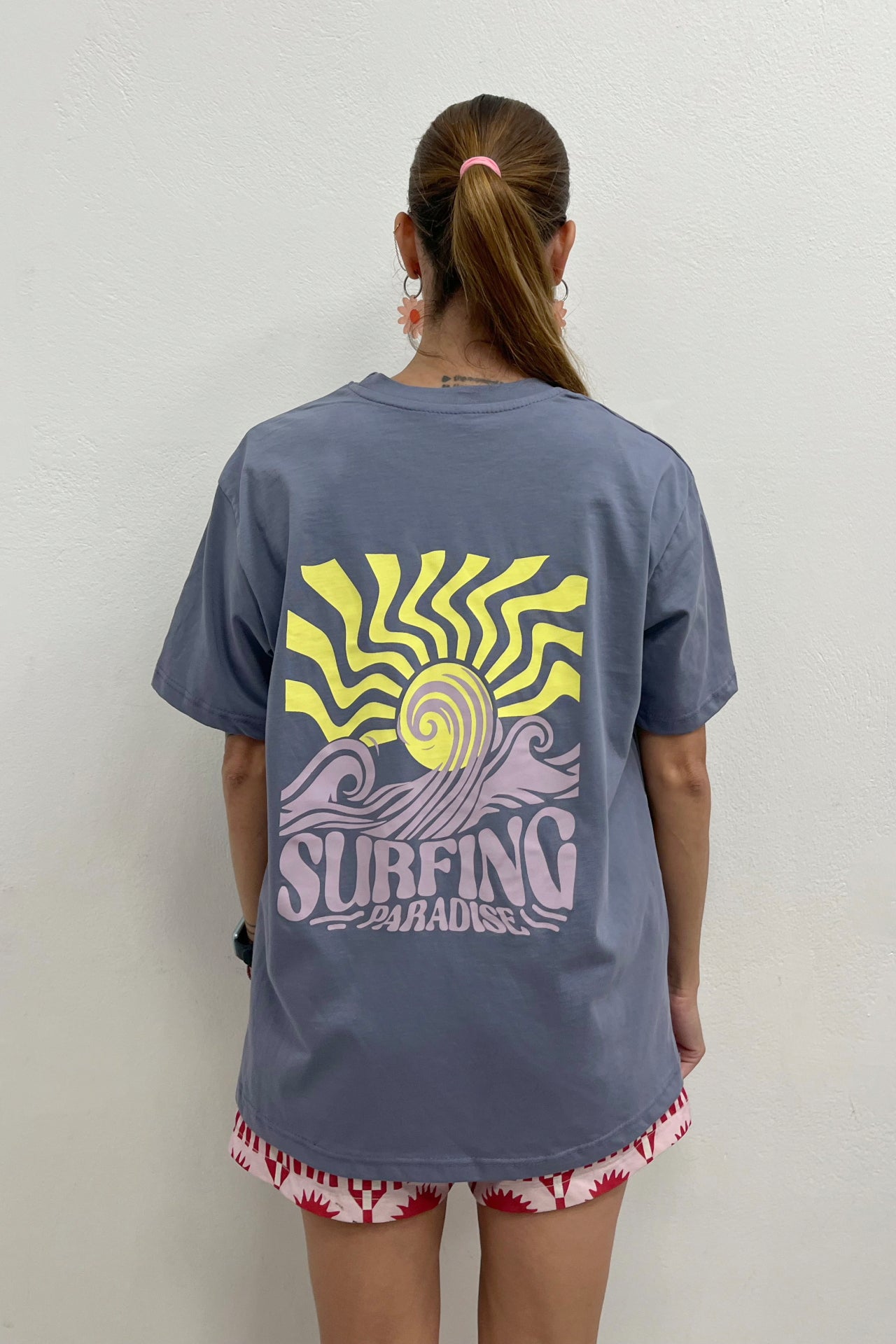 Featuring an oversized unisex fit and an original sun-and-wave graphiC by Sevi Waves 