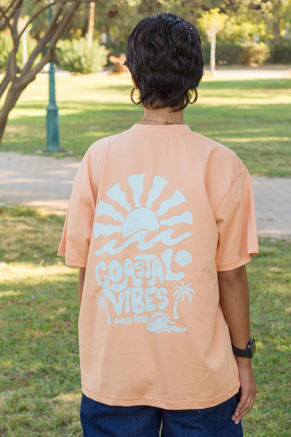 Close-up of the retro surf graphic on the Sevi Waves oversized tshirt 
