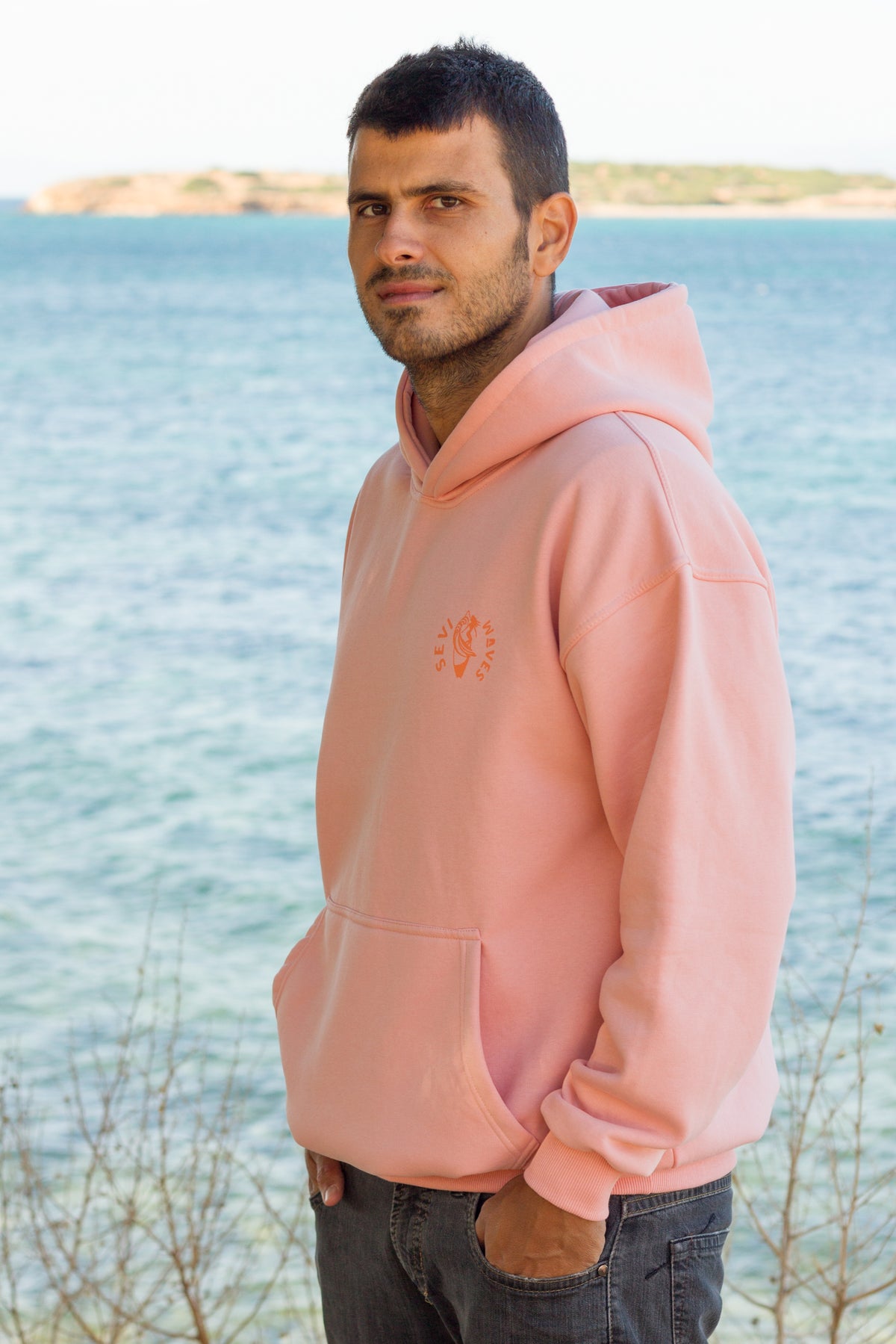 Sevi Waves salmon oversized hoodie  showcasing its surf-inspired back print.