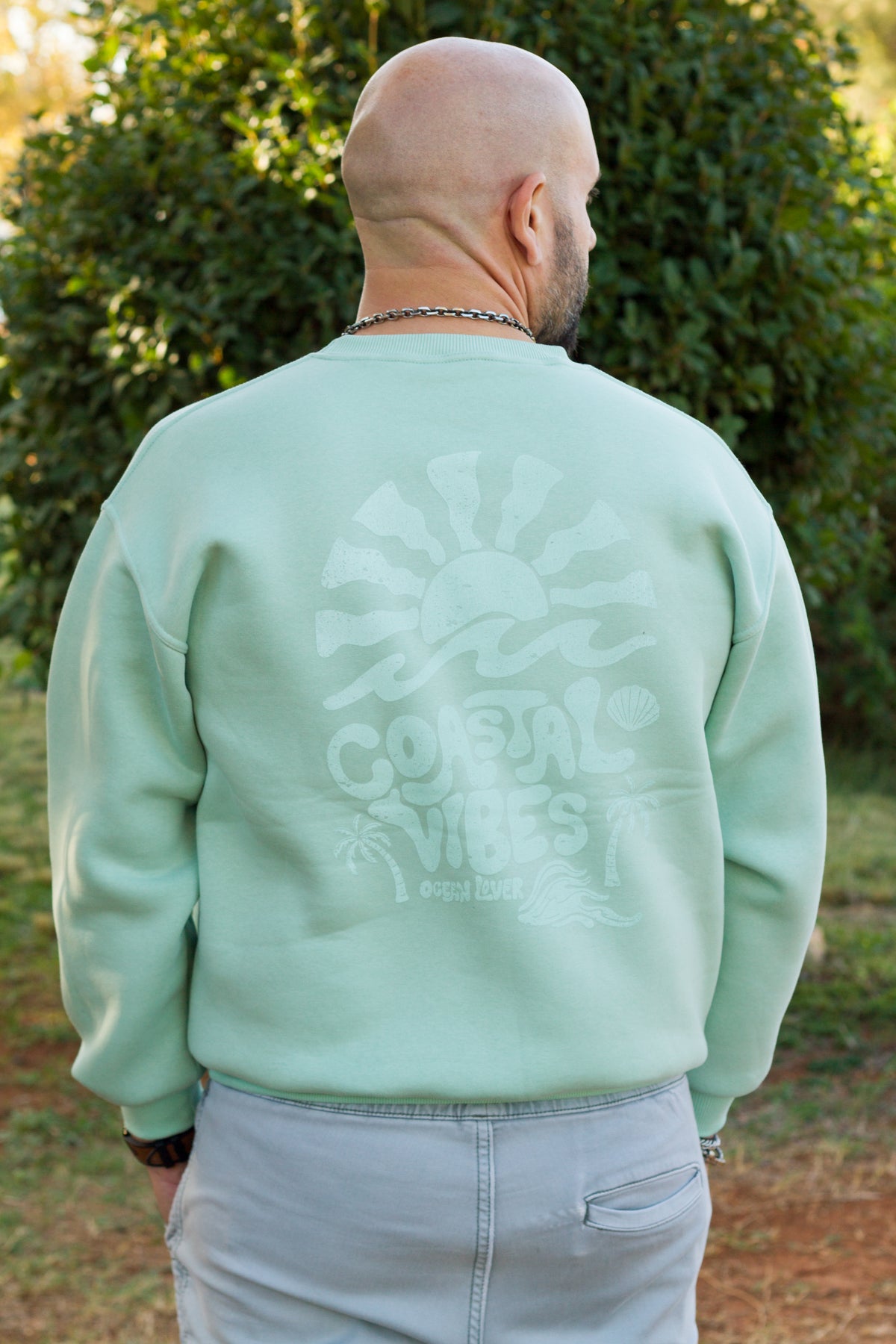 Back view of the Sevi Waves mint oversized crewneck from the TIDE SHIFT FW26/27 collection.
