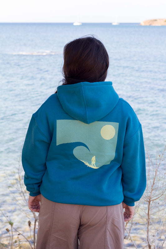 Close-up of the back print on the petrol blue Sevi Waves oversized hoodie.